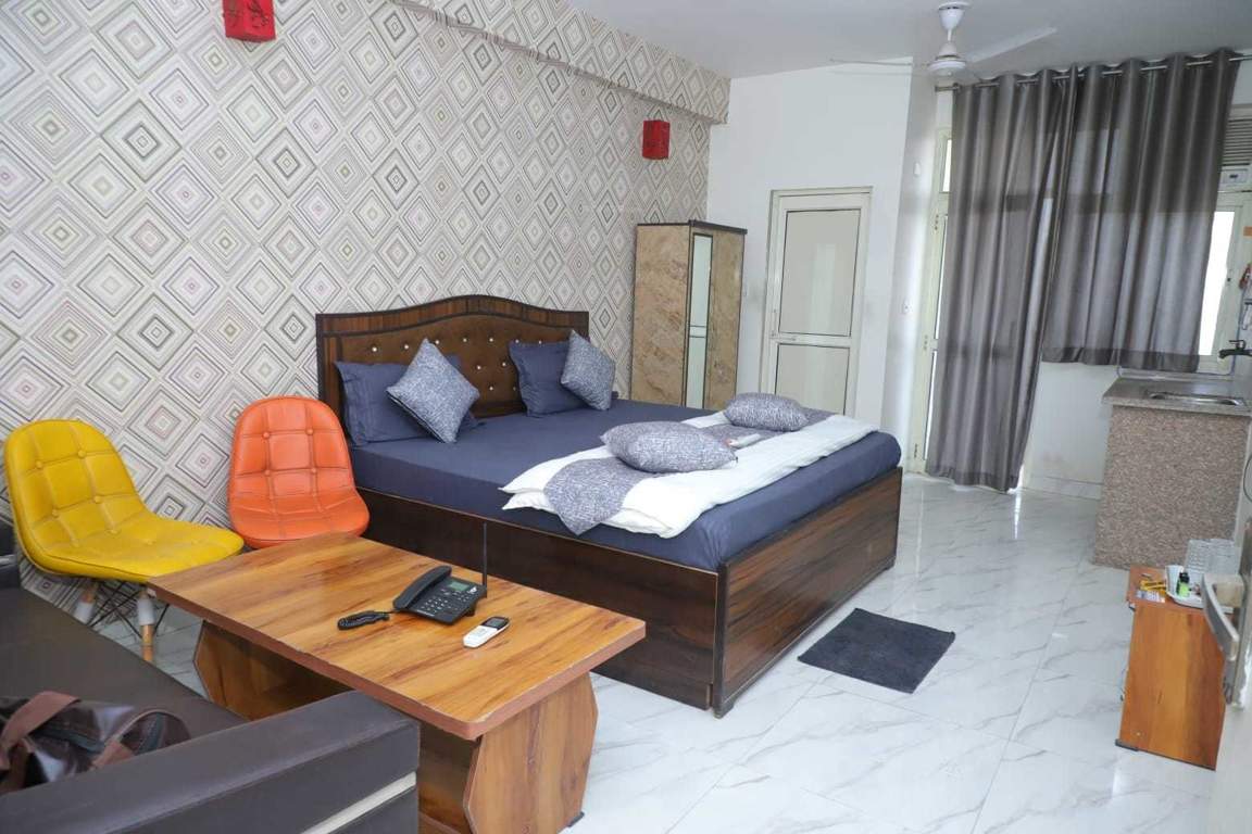  krishna orchid studio apartments Bedroom