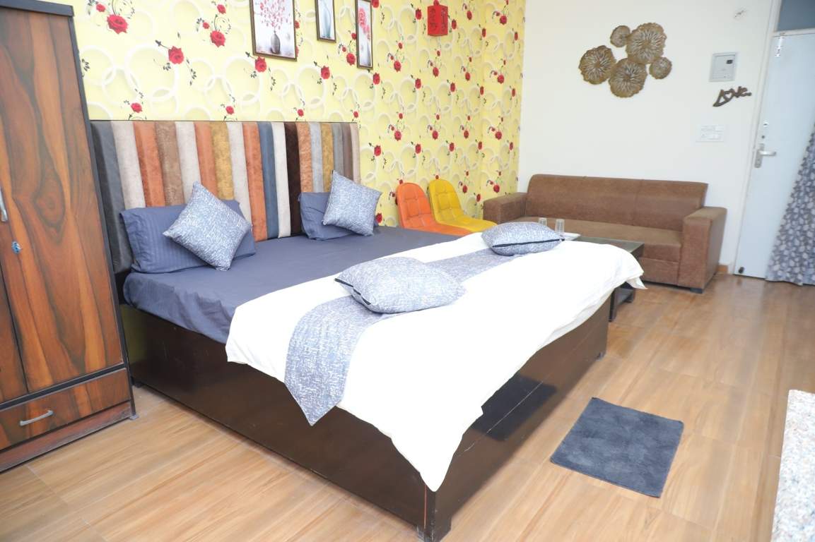  krishna orchid studio apartments Bedroom